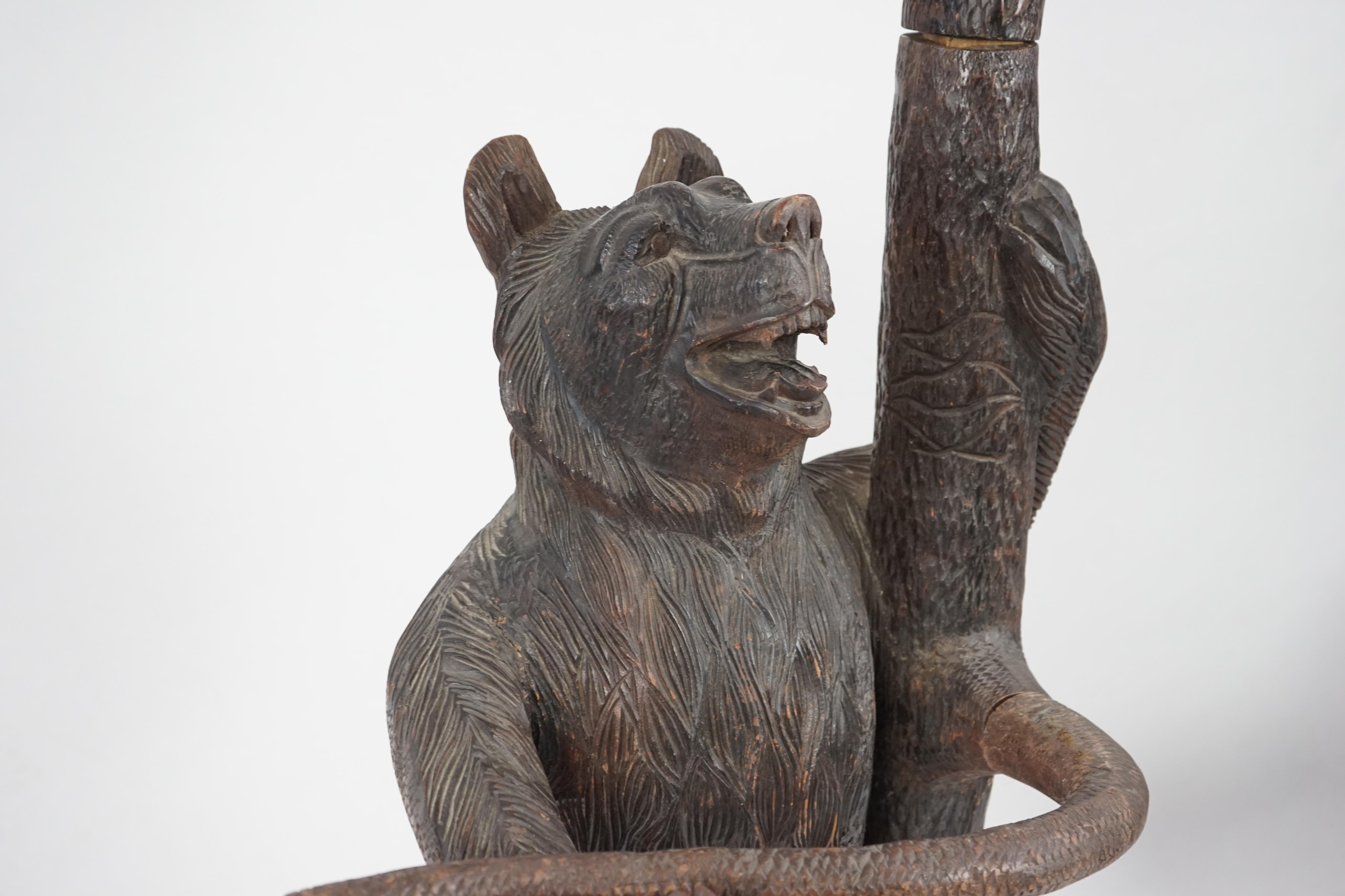 A late 19th/early 20th century Swiss ‘’Black Forest’’ carved wood hall stand